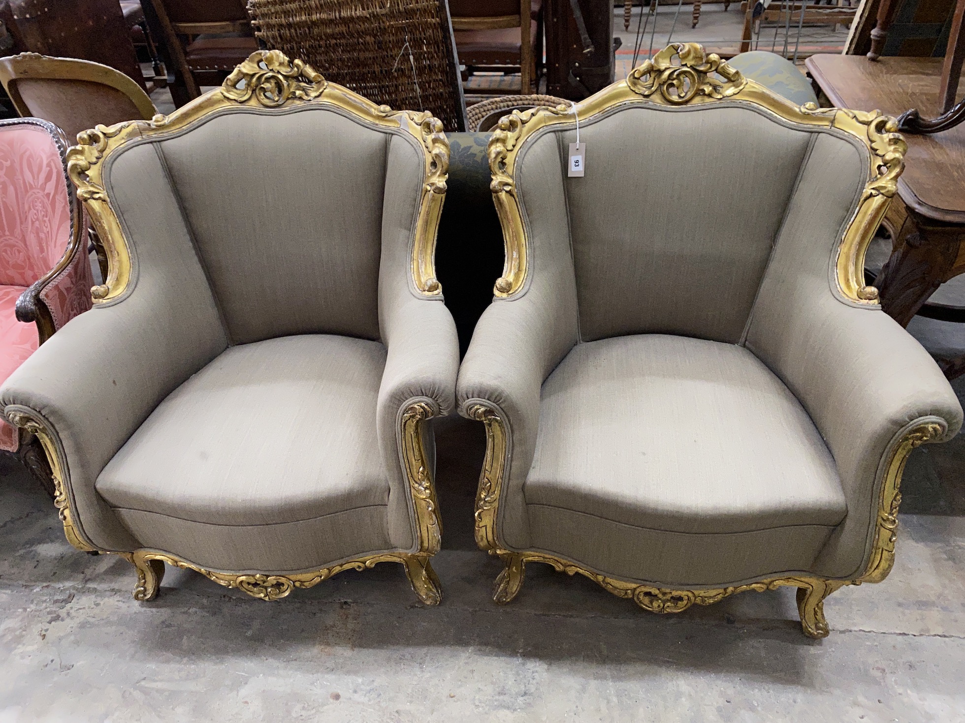A pair of Louis XVI style carved giltwood and composition upholstered armchairs, width 85cm, depth 64cm, height 102cm